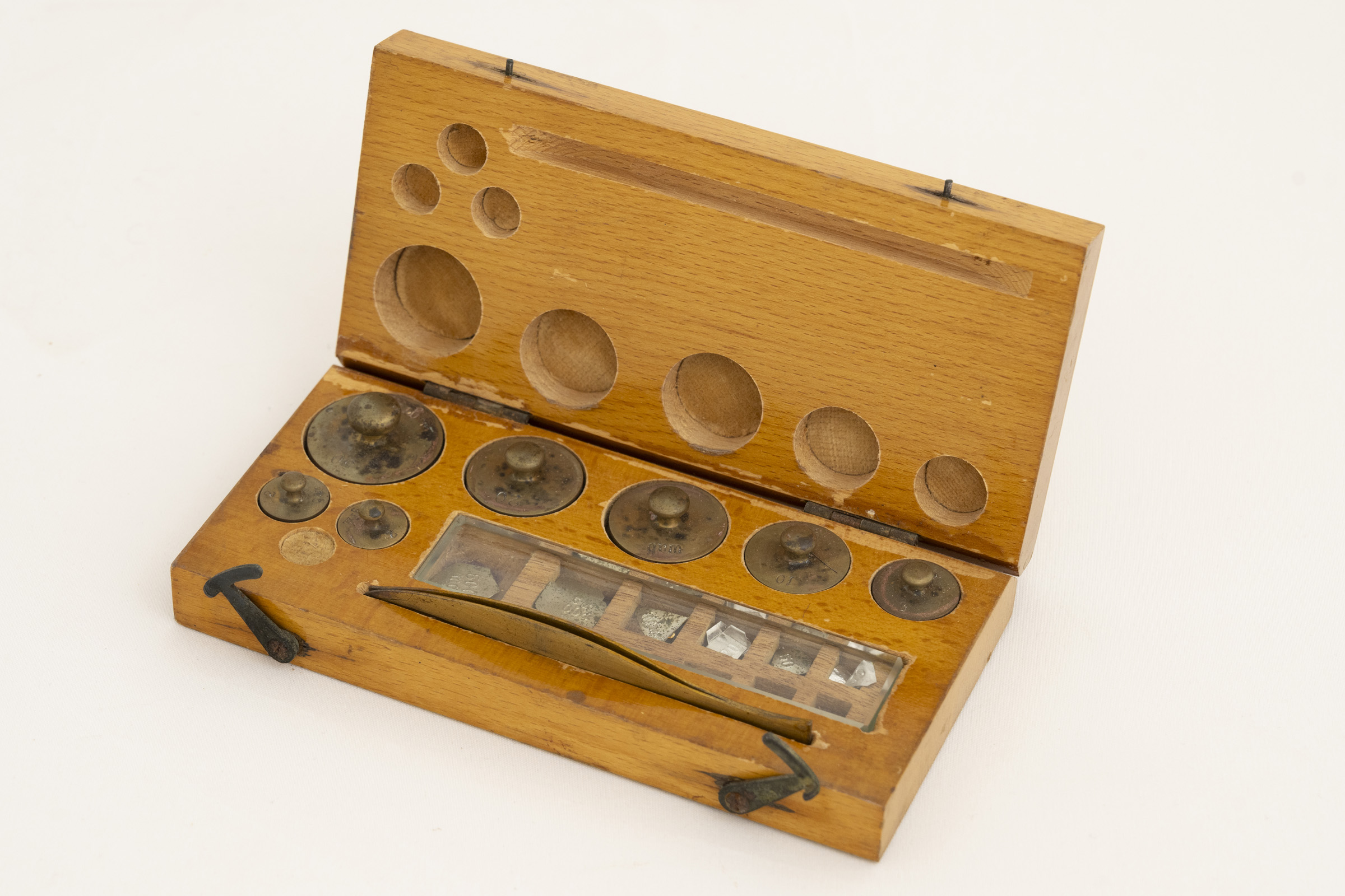 Small wooden box containing brass weights